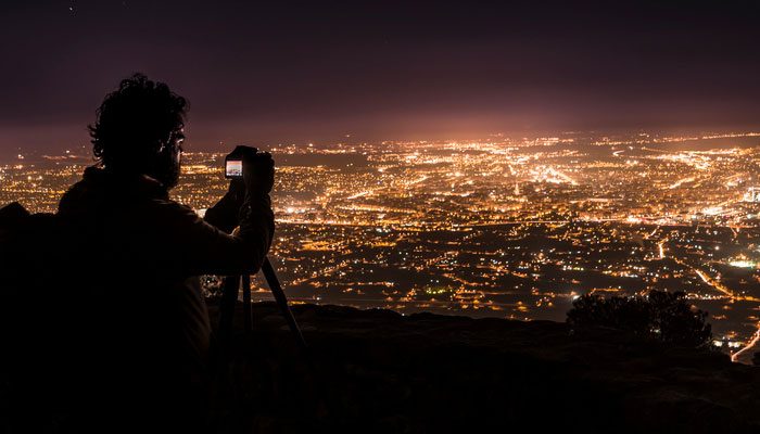 man-taking-pictures-of-city.jpg